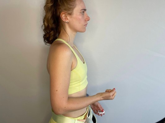 A close-up of the author's hands and posture before she started walking with Bala Bangles